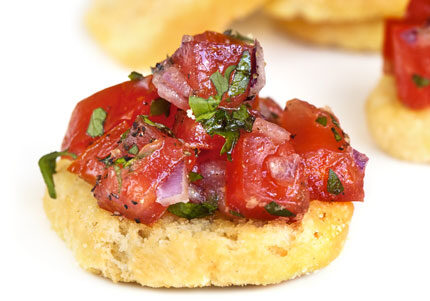 Bruschetta with tomatoes and herbs on bread.